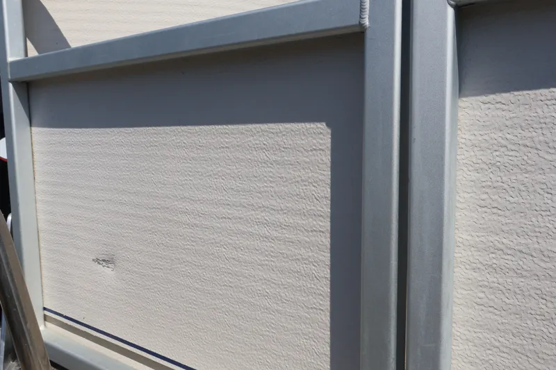 Slide: The Image of Close-up of 2008 Premier 210 Sunsation boat panel with textured surface and metal frame. - 17