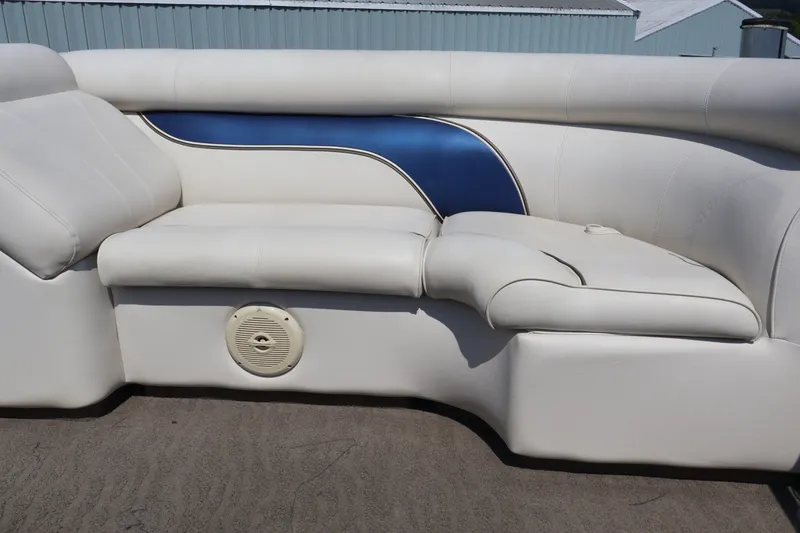 Slide: The Image of 2008 Premier 210 Sunsation boat seating with white and blue upholstery, featuring a built-in speaker. - 55