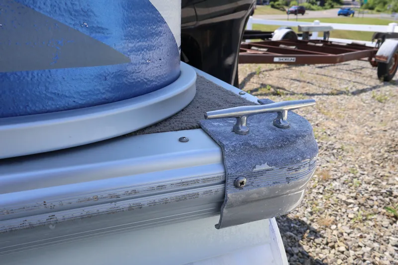 Slide: The Image of 2008 Premier 210 Sunsation boat detail with cleat and trailer in background. - 6