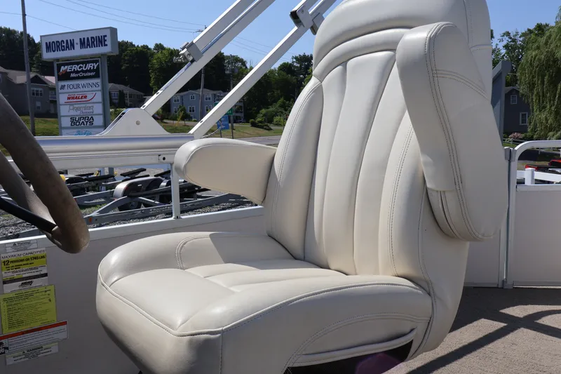 Slide: The Image of 2008 Premier 210 Sunsation boat seat with white upholstery at Morgan Marine dealership. - 42