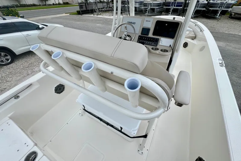 Slide: The Image of 2026 Boston Whaler 250 Dauntless boat interior with helm and rod holders. - 14