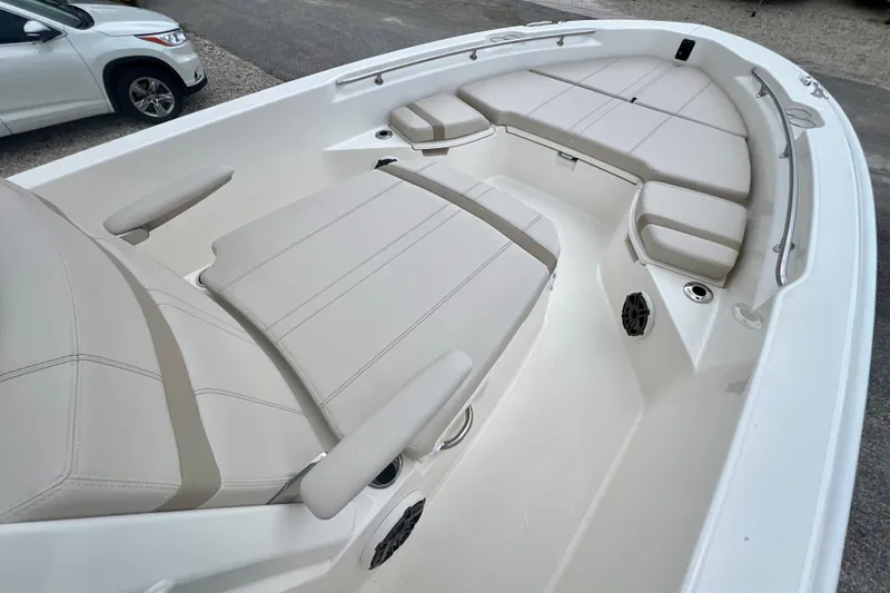 Slide: The Image of 2026 Boston Whaler 250 Dauntless boat interior with beige seating and armrests. - 30