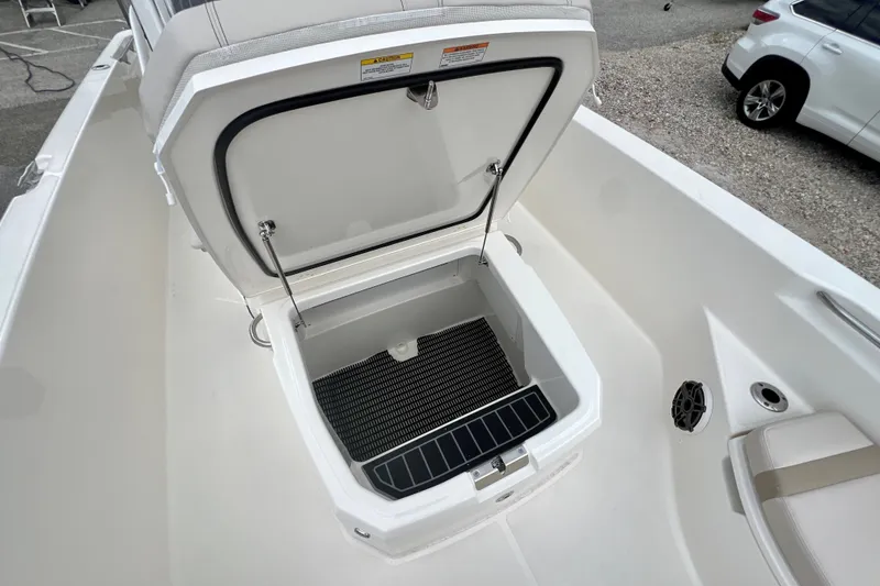 Slide: The Image of Open storage compartment on 2026 Boston Whaler 250 Dauntless boat deck. - 31