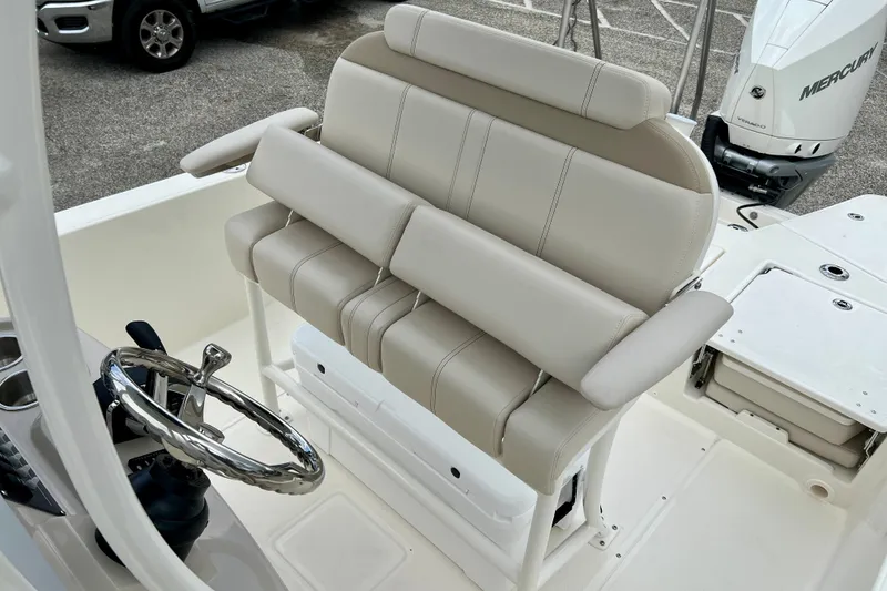 Slide: The Image of 2026 Boston Whaler 250 Dauntless boat interior with steering wheel and seating. - 18