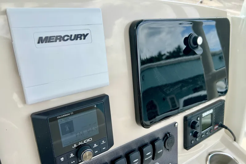 Slide: The Image of Control panel of 2026 Boston Whaler 250 Dauntless with Mercury and Simrad electronics. - 25