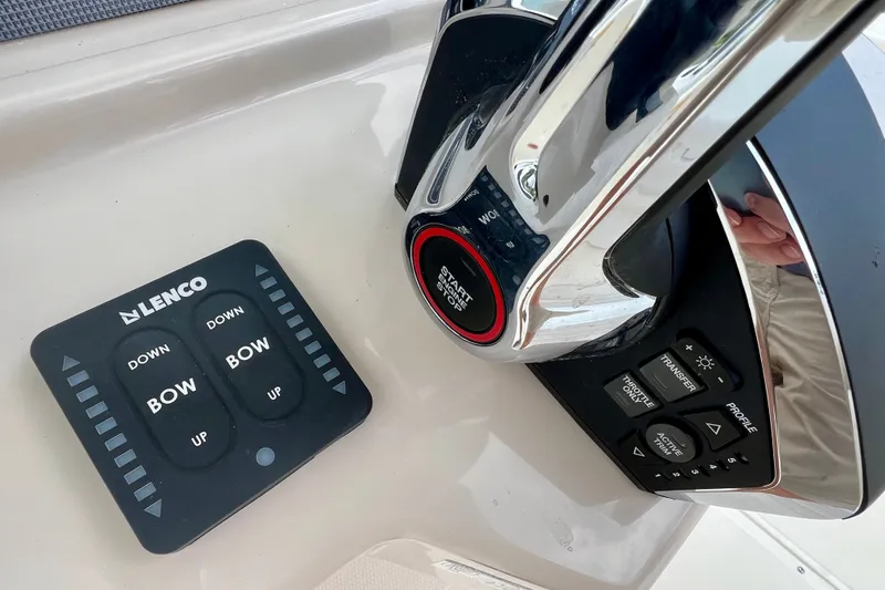 Slide: The Image of Control panel of a 2026 Boston Whaler 250 Dauntless boat with Lenco trim tab switches. - 22