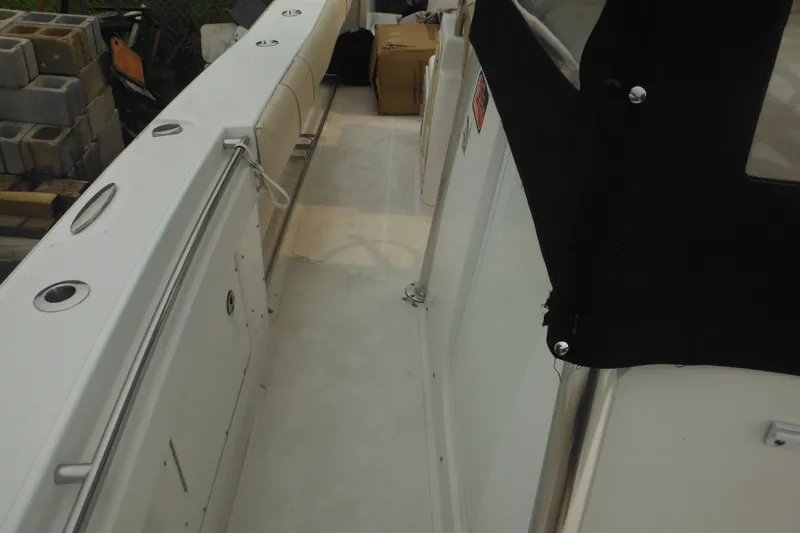 Slide: The Image of 2006 Southport 26 Center Console boat interior with seating and storage compartments. - 25