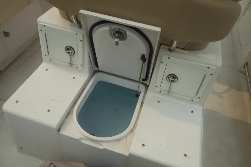 Slide: The Image of Livewell and storage compartments on a 2006 Southport 26 Center Console boat. - 16