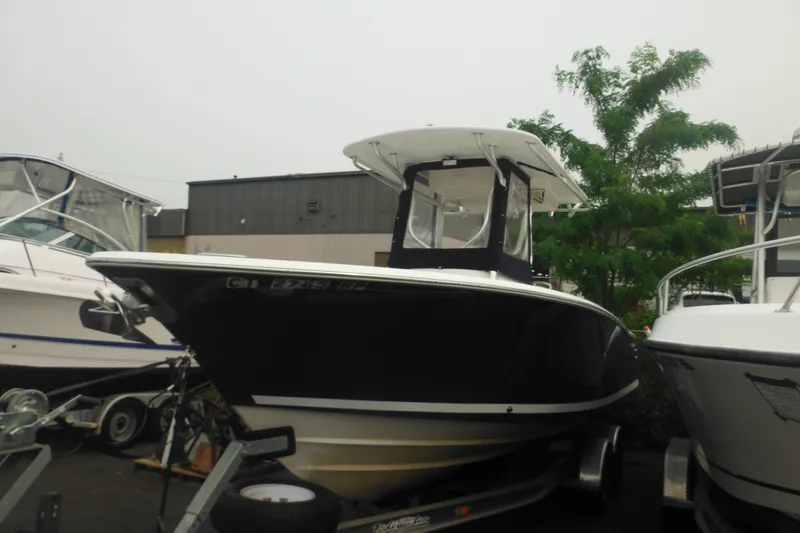 Slide: The Image of 2006 Southport 26 Center Console boat on trailer, parked outdoors. - 4