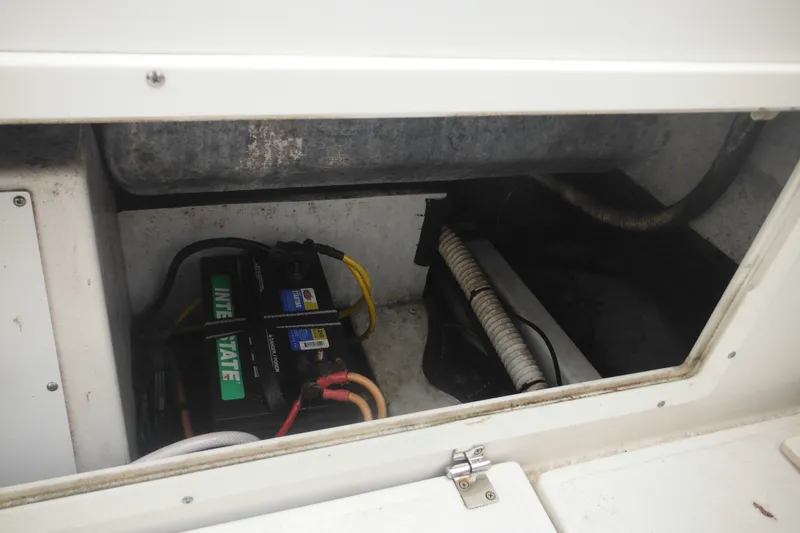 Slide: The Image of Battery compartment of a 2006 Southport 26 Center Console boat, featuring Interstate battery. - 57