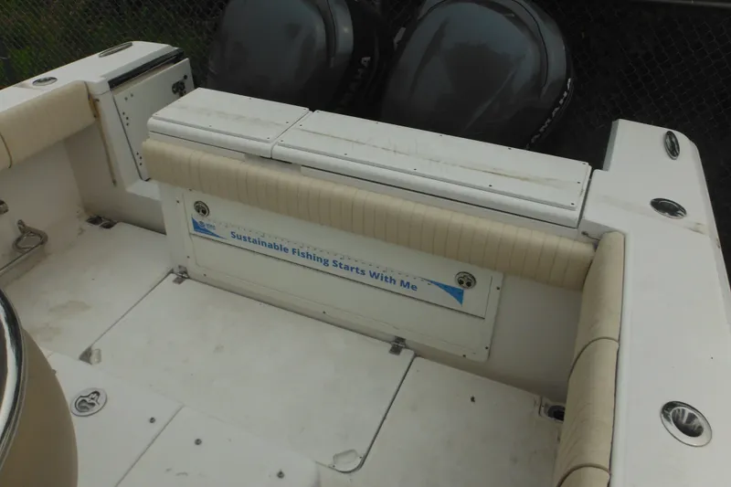 Slide: The Image of 2006 Southport 26 Center Console boat interior with "Sustainable Fishing Starts With Me" sign. - 66