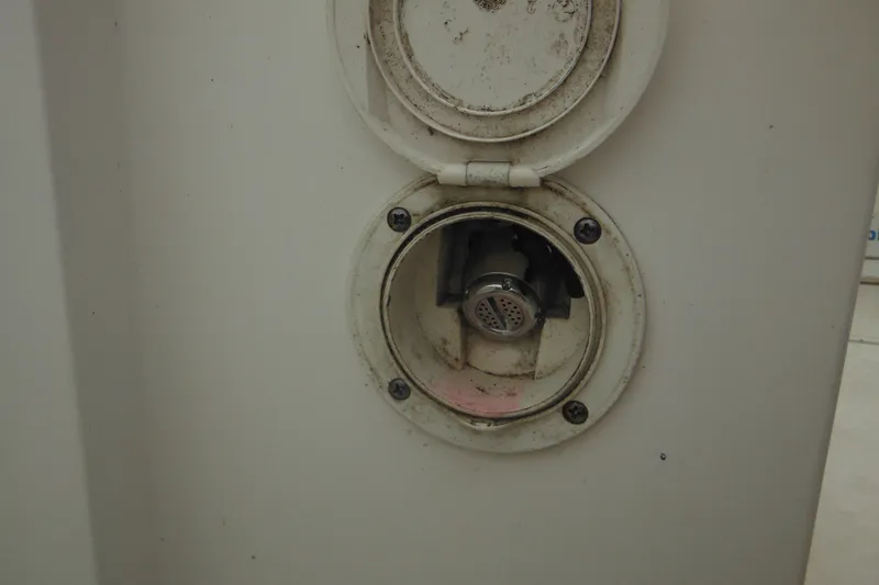 Slide: The Image of Close-up of a 2006 Southport 26 Center Console boat's electrical socket. - 58