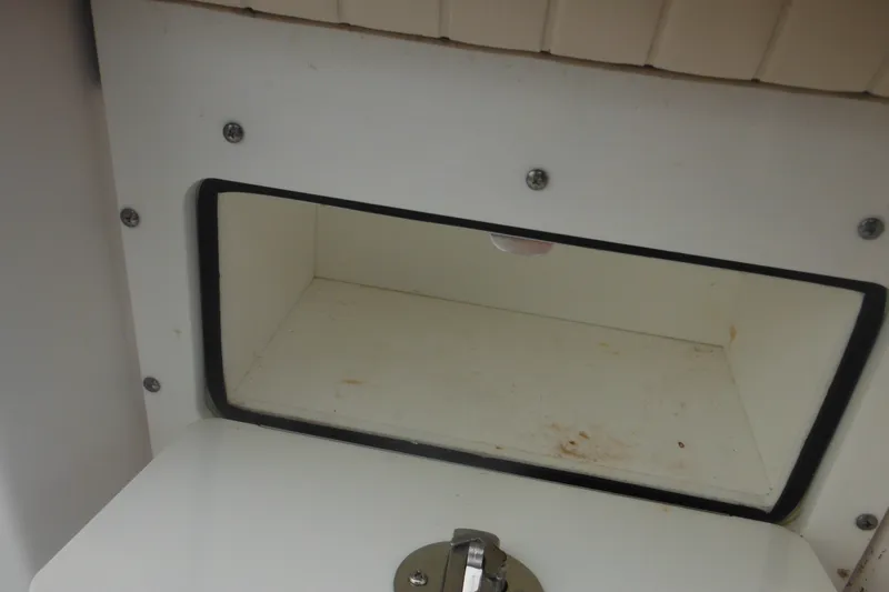 Slide: The Image of Storage compartment in a 2006 Southport 26 Center Console boat. - 36