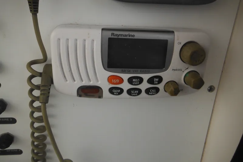 Slide: The Image of Raymarine VHF radio on 2006 Southport 26 Center Console boat dashboard. - 42