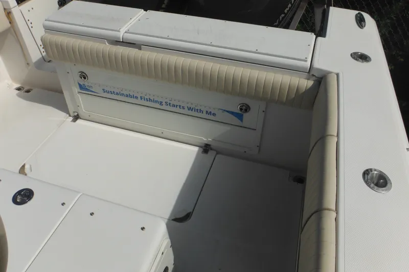 Slide: The Image of 2006 Southport 26 Center Console boat interior with sustainable fishing message. - 83