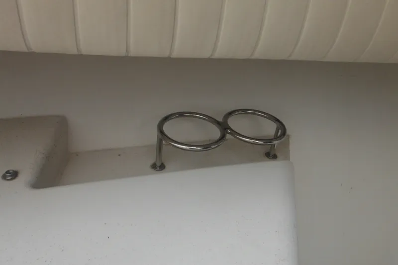 Slide: The Image of Stainless steel cup holders on 2006 Southport 26 Center Console boat interior. - 63