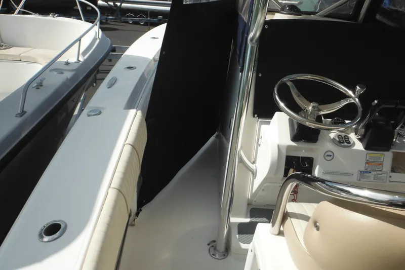 Slide: The Image of 2006 Southport 26 Center Console boat interior with steering wheel and seating. - 81