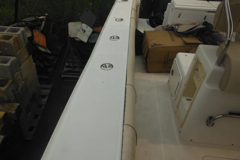 Slide: The Image of 2006 Southport 26 Center Console boat interior with seating and storage compartments. - 28