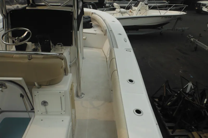 Slide: The Image of 2006 Southport 26 Center Console boat interior with steering wheel and seating. - 15