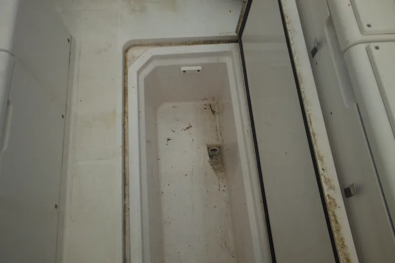 Slide: The Image of Storage compartment of a 2006 Southport 26 Center Console boat, showing interior details. - 47