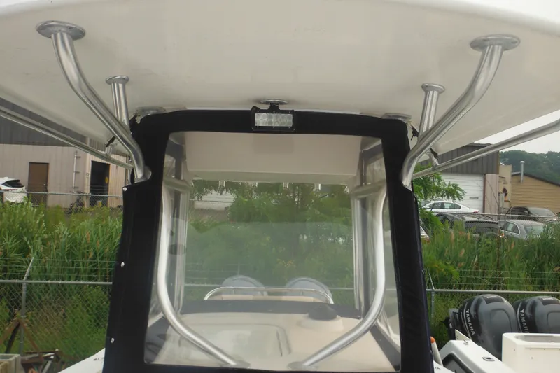 Slide: The Image of 2006 Southport 26 Center Console boat with T-top and clear enclosure. - 22