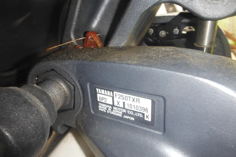 Slide: The Image of Close-up of Yamaha F250TXR engine part on 2006 Southport 26 Center Console boat. - 9