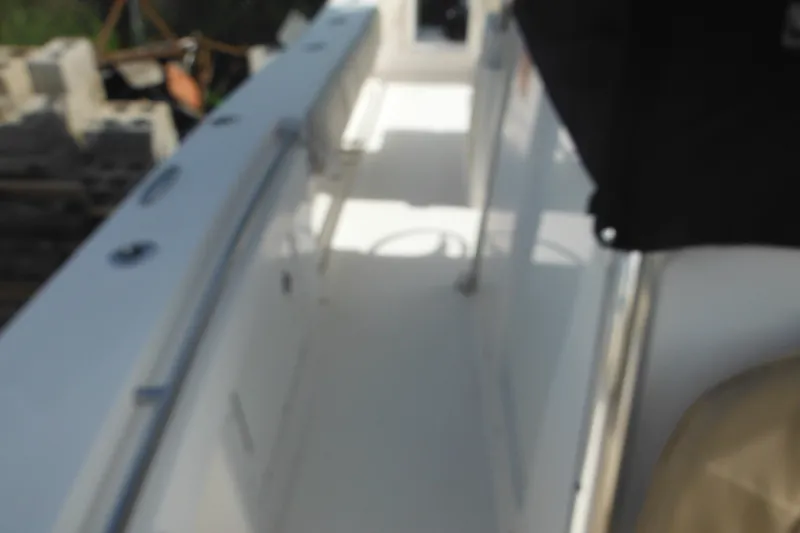 Slide: The Image of Blurry view of a 2006 Southport 26 Center Console boat interior. - 73
