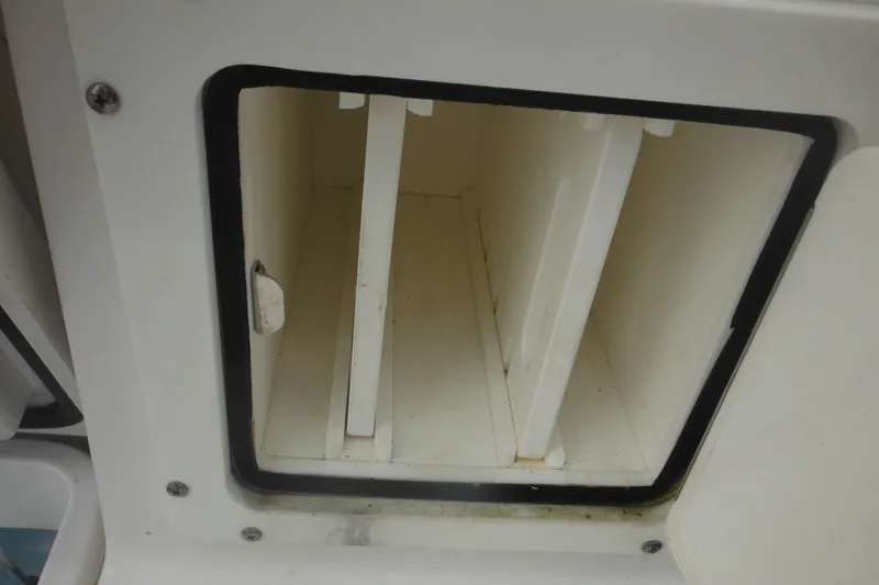 Slide: The Image of Storage compartment on a 2006 Southport 26 Center Console boat. - 35