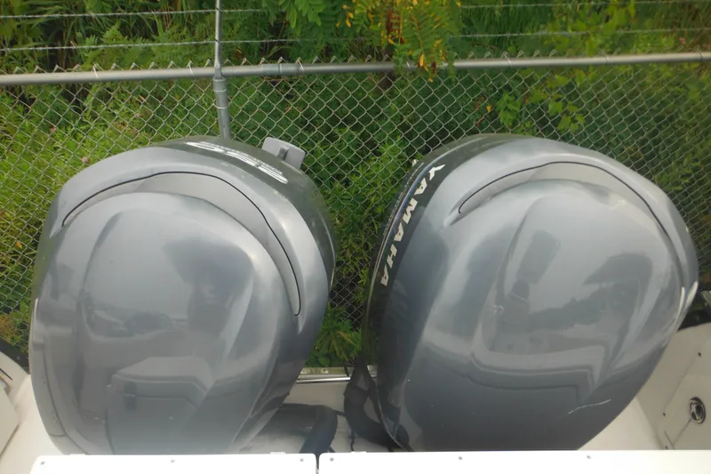 Slide: The Image of Twin Yamaha outboard motors on a 2006 Southport 26 Center Console boat. - 54