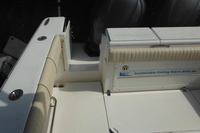 Slide: The Image of 2006 Southport 26 Center Console boat interior with seating and sustainability message. - 84