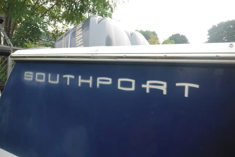 Slide: The Image of 2006 Southport 26 Center Console boat with Yamaha engine, blue hull. - 3