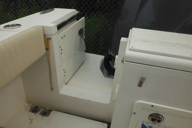 Slide: The Image of 2006 Southport 26 Center Console boat interior with seating and storage compartments. - 52
