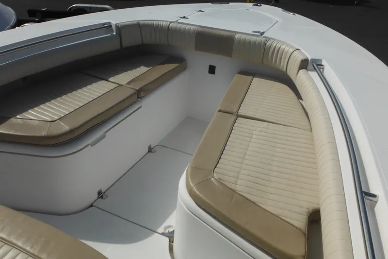 Slide: The Image of 2006 Southport 26 Center Console boat with cushioned seating area. - 69