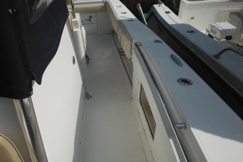 Slide: The Image of 2006 Southport 26 Center Console boat interior with seating and storage compartments. - 72
