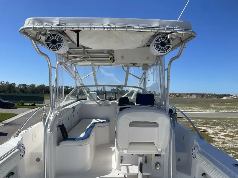 Slide: The Image of The image shows the cockpit of a 2004 Pro-Line 30 Express Walkaround with seating area and helm. - 33
