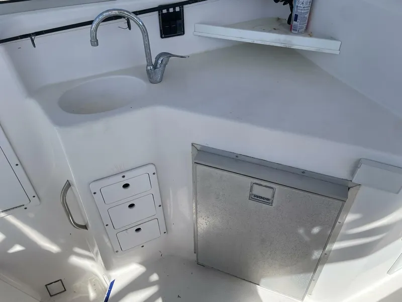 Slide: The Image of Galley area with sink and refrigerator on a boat. - 24