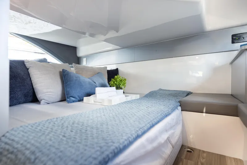 Slide: The Image of Luxurious interior of 2026 Hanover 347 yacht with cozy bedding and modern decor. - 32