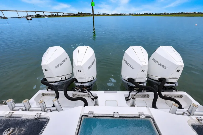 Slide: The Image of Freeman 37 boat with four Mercury outboard engines on calm water, 2014 model. - 7