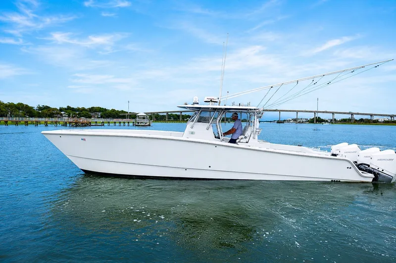 Slide: The Image of 2014 Freeman 37 boat cruising on a sunny day with clear blue skies. - 2