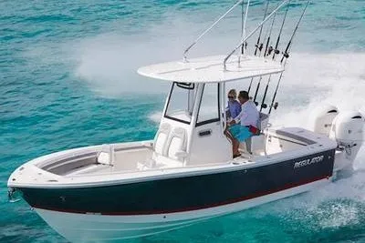 The Image of 2027 Regulator 23 boat cruising on clear blue ocean waters. - 1