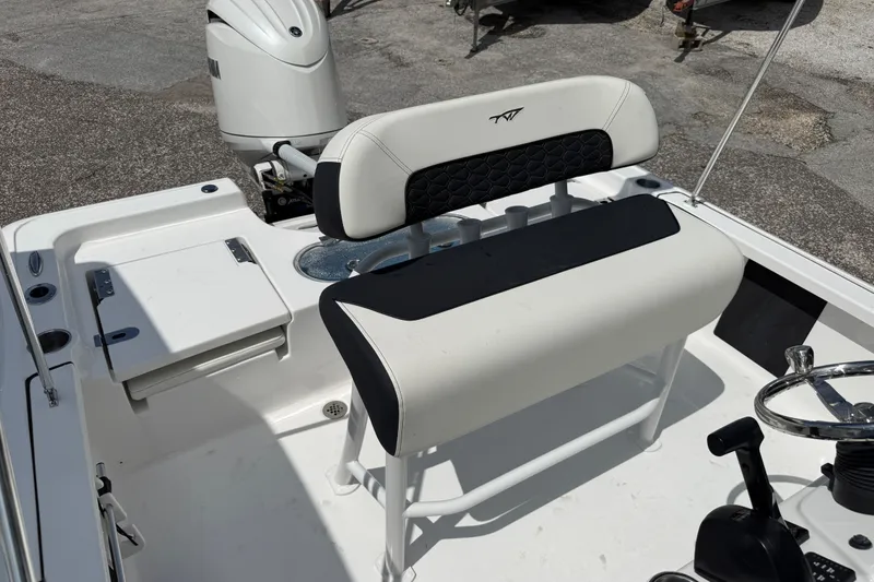 Slide: The Image of 2027 Tidewater 1910 Bay Max boat interior with seating and steering wheel. - 8