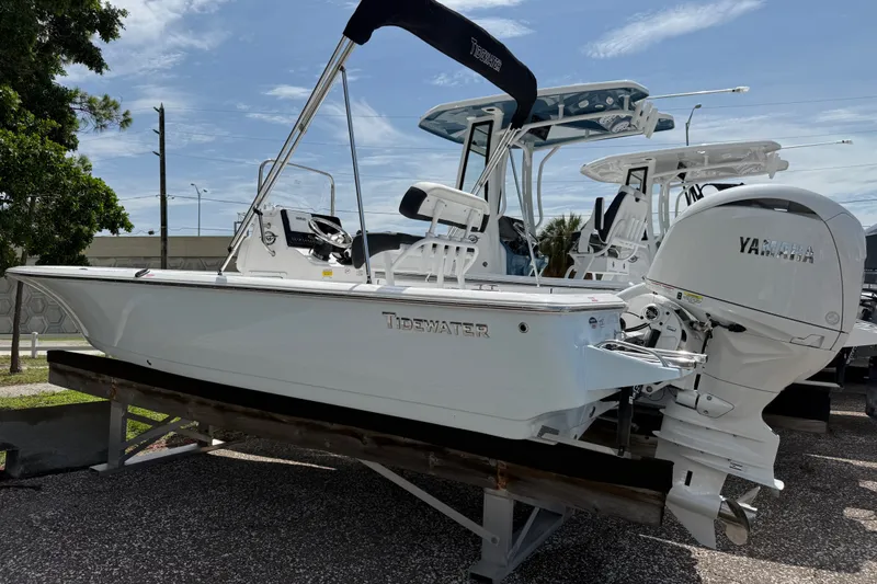 Slide: The Image of 2027 Tidewater 1910 Bay Max boat with Yamaha engine on display outdoors. - 2