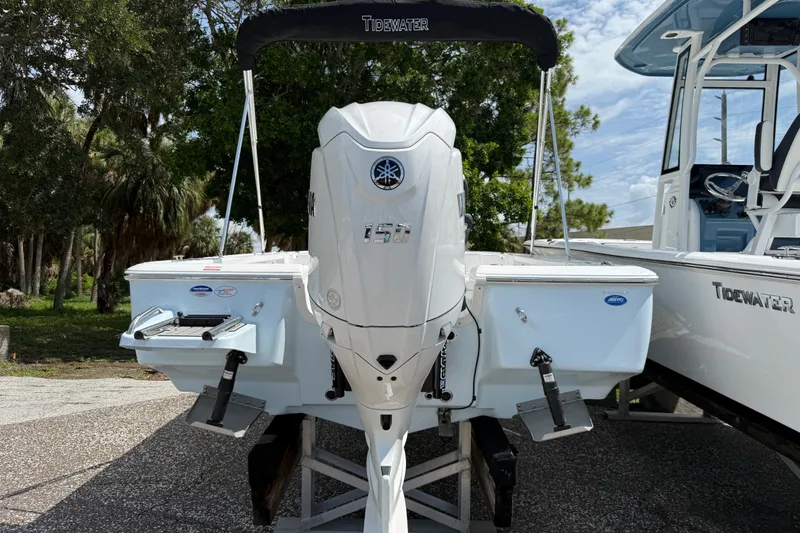 Slide: The Image of 2027 Tidewater 1910 Bay Max boat with Yamaha outboard motor, displayed outdoors. - 3