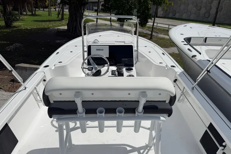 Slide: The Image of 2027 Tidewater 1910 Bay Max boat interior with steering console and seating. - 4