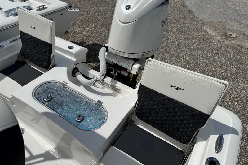 Slide: The Image of 2027 Tidewater 1910 Bay Max boat interior with seating and motor, showcasing modern design. - 10