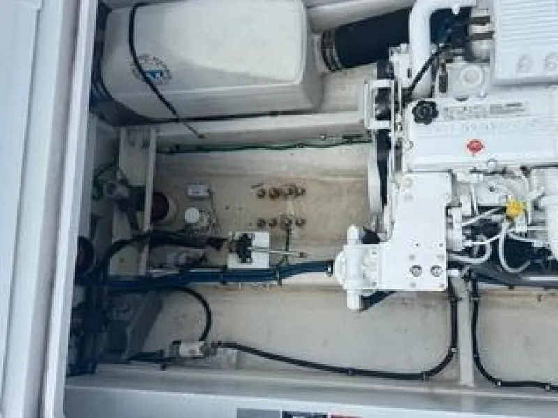 Slide: The Image of The engine compartment of a 2019 OceanPro 35 boat shows a clean, well-organized engine. - 11