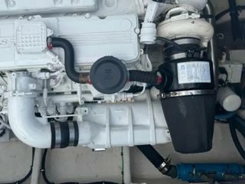 Slide: The Image of A clean, modern boat engine with white and black components. - 4