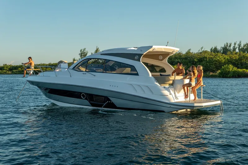 Slide: The Image of Luxury Hanover 375 yacht, 2026 model, cruising with passengers enjoying the water. - 64