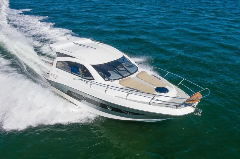 Slide: The Image of 2026 Hanover 375 yacht cruising on open water, showcasing sleek design and luxury features. - 12
