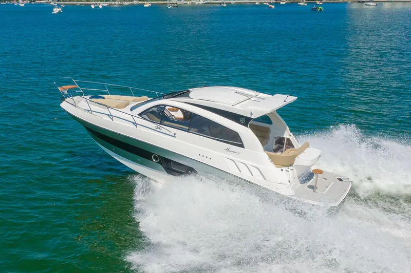 Slide: The Image of Luxury Hanover 375 yacht cruising on open water, 2026 model. - 13